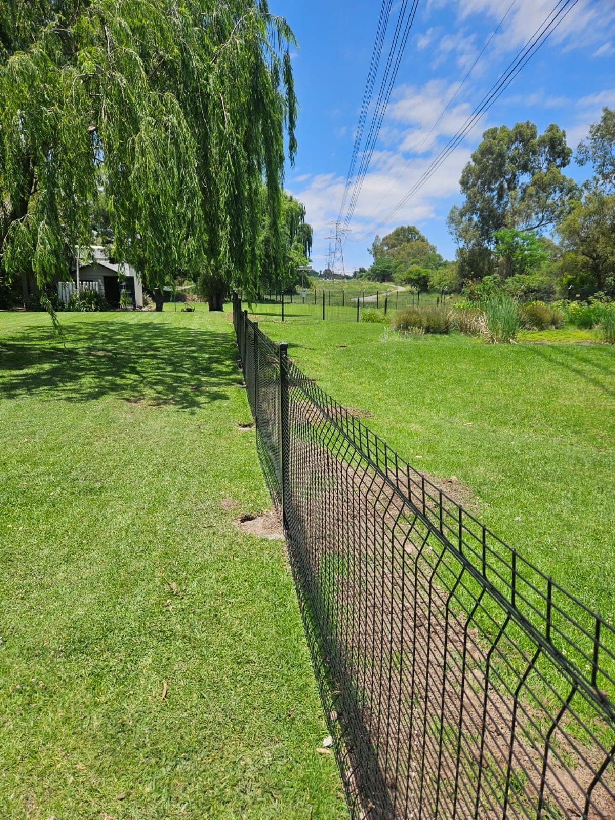 Black powder-coated boundary fence